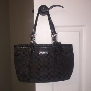 Black coach purse with logo pattern